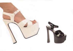 Candy 40 6 1/2 Chunky heel. Ankle strap has 
buckle. Criss Cross toe straps. Colors: 
Black Pat. and White Pat. Sizes: 6-12