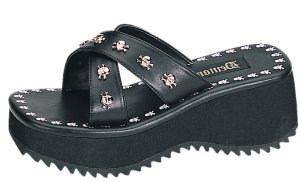 Flip-05 Sandals w/Skulls *NEW* NEW!! Double strap sandals with skull and cross bones on outer edges of sandals and on top of foot straps. Heel height: 2 1/2. Color as shown in black PU w/skull studs. Sizes: 6-12.